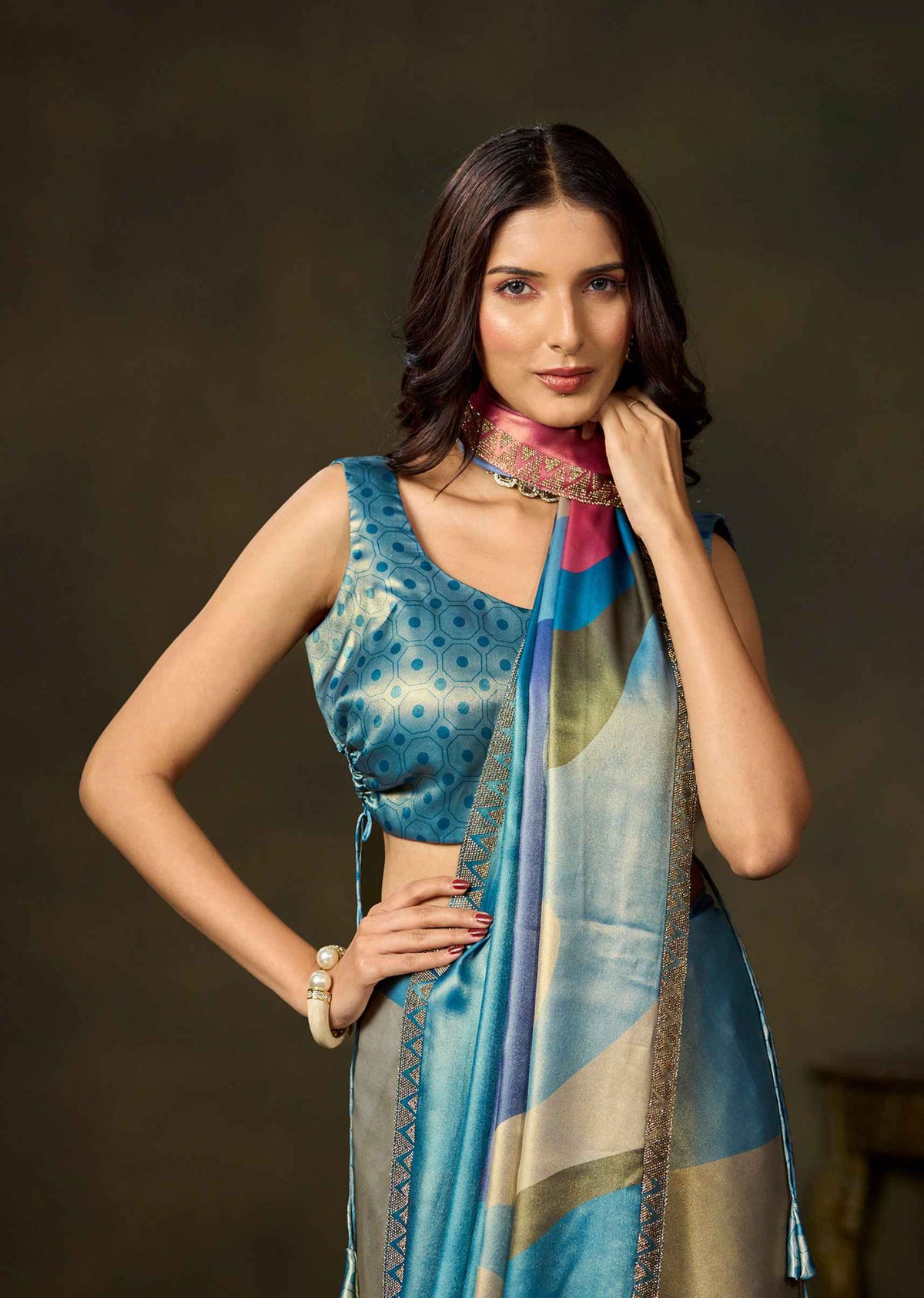Matching blue blouse paired with a multicolor color block printed satin silk saree by Ethnic9.