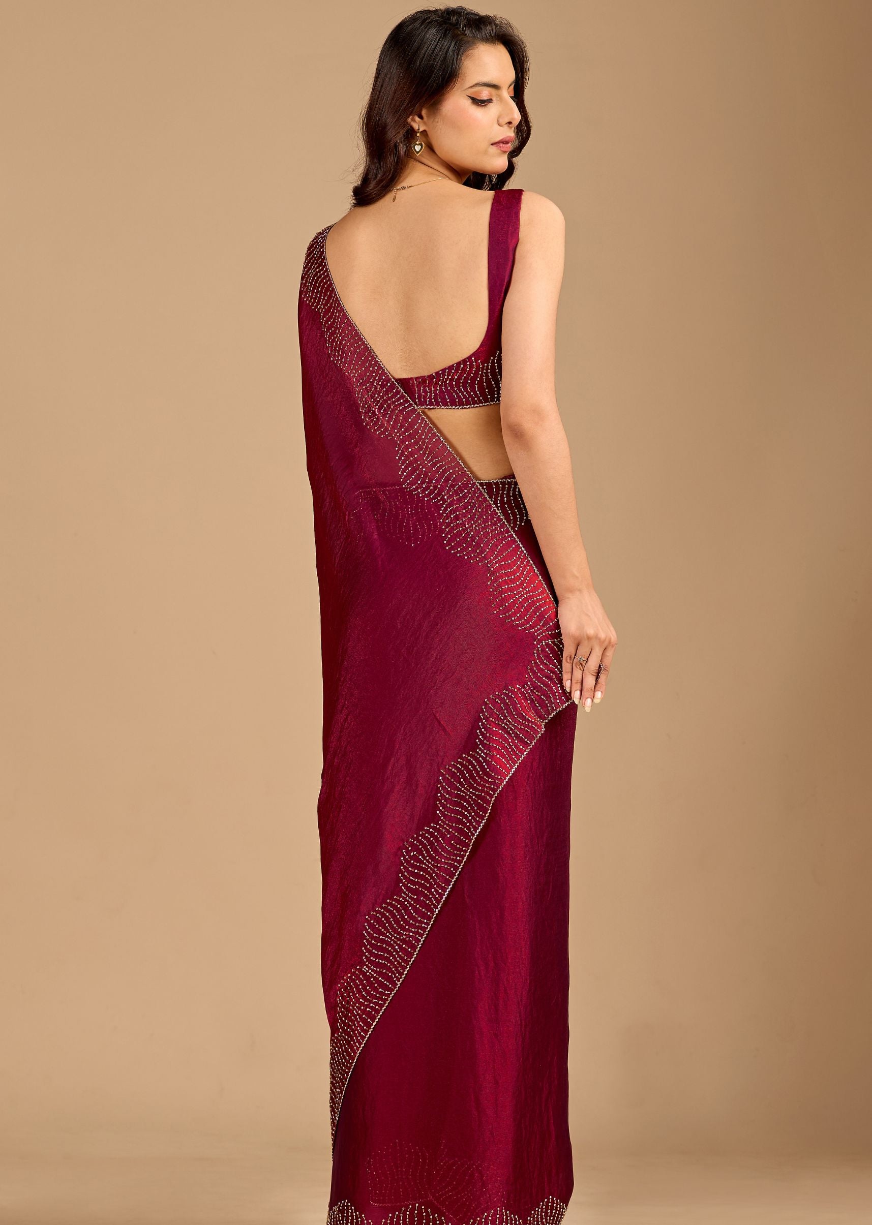 Wine Organza Saree with Stone Work Border & Designer Wave Pattern