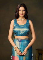 Front view of a blue blouse paired with a blue and multicolor printed satin silk saree by Ethnic9.