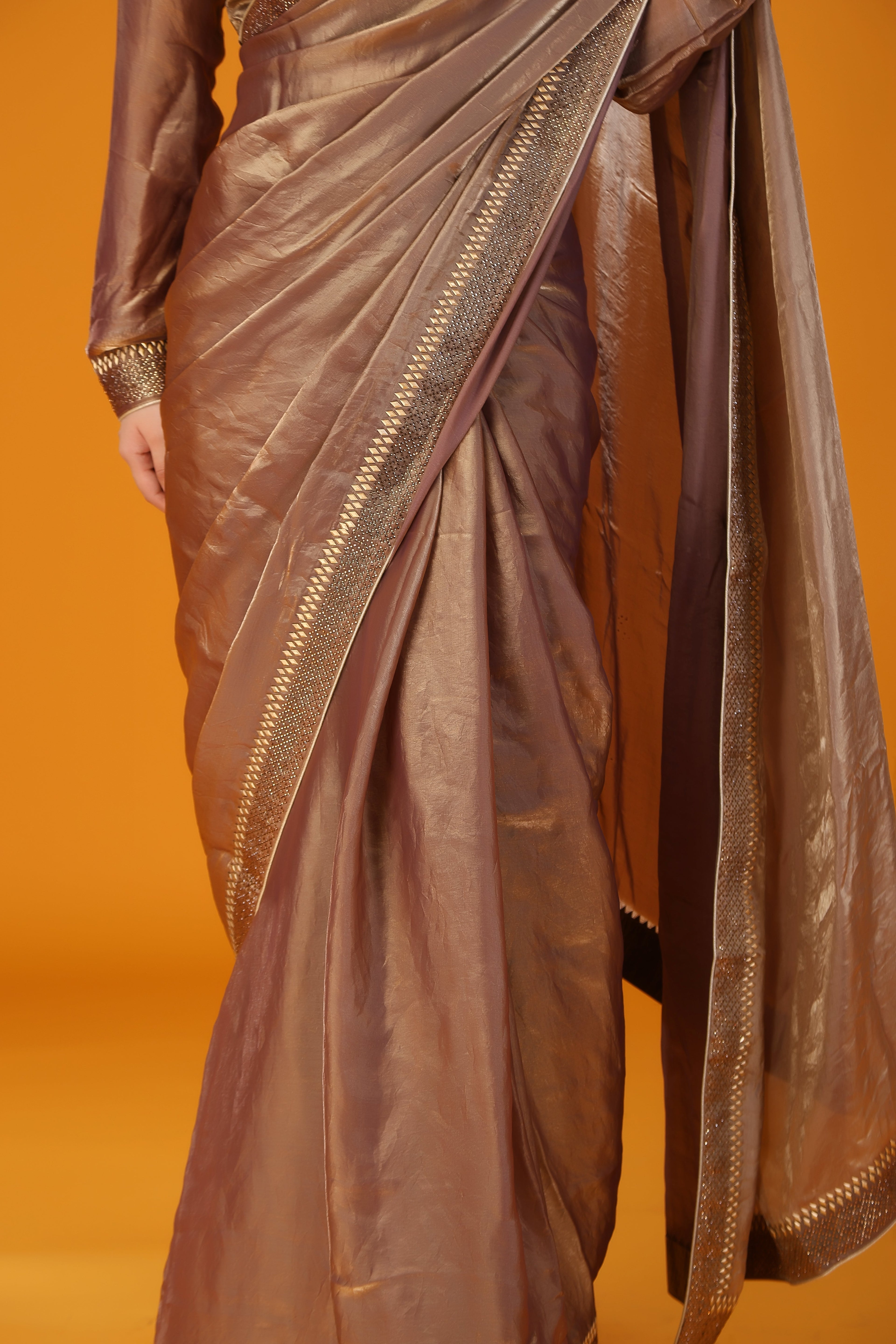 Brown metallic beads and stone work saree