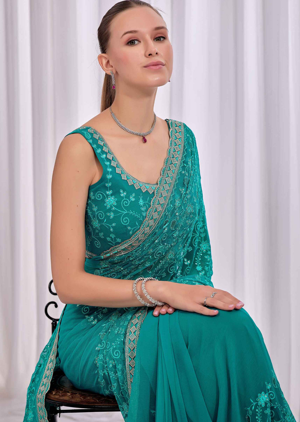 Firozi Chiffon Saree With Floral Embroidery And Stone Border