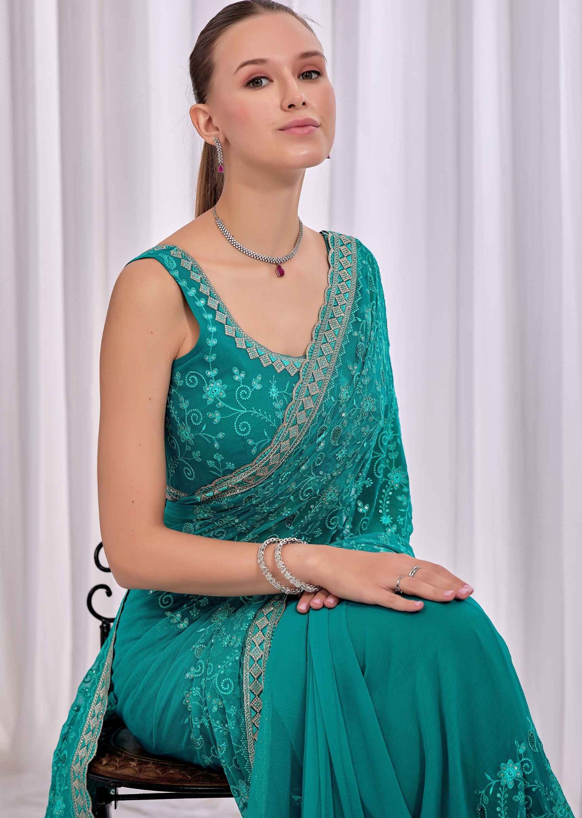 Firozi Chiffon Saree With Floral Embroidery And Stone Border
