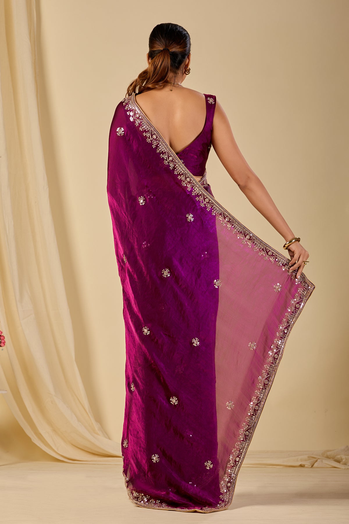 Wine purple organza saree with delicate floral embroidery