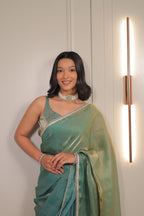 Pastel Mint Green Satin Silk Saree with Printed Blouse & Designer Lace Border – Festive Wear