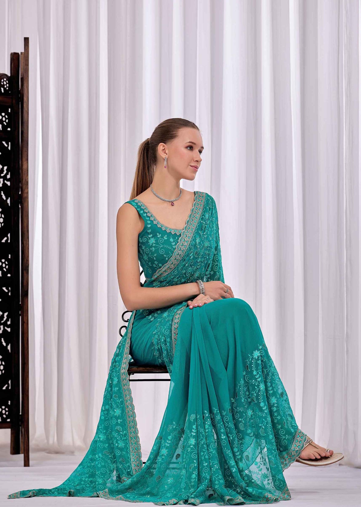Firozi Chiffon Saree With Floral Embroidery And Stone Border