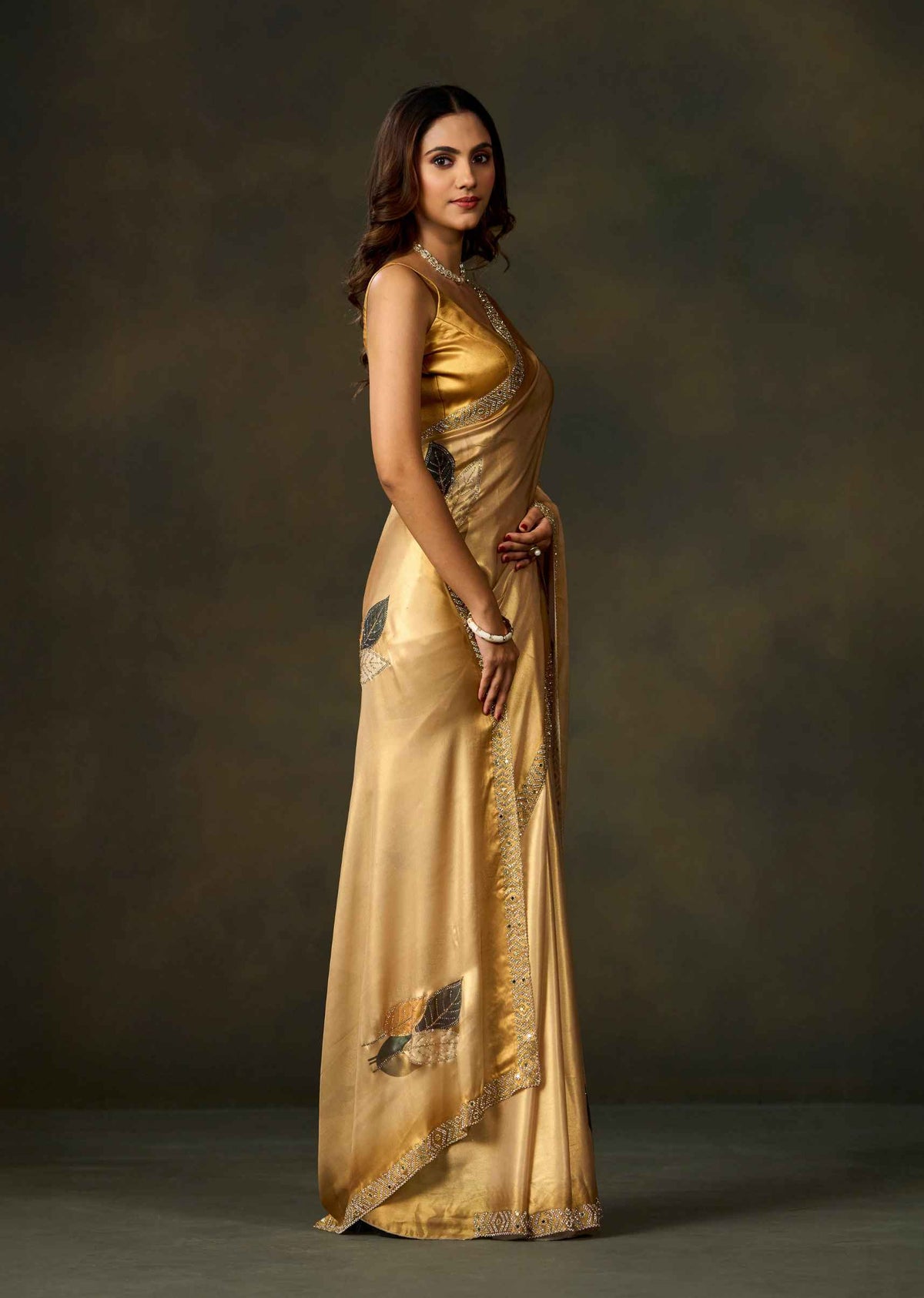 Golden Satin Silk Saree With Leaf Motifs And Embellished Border