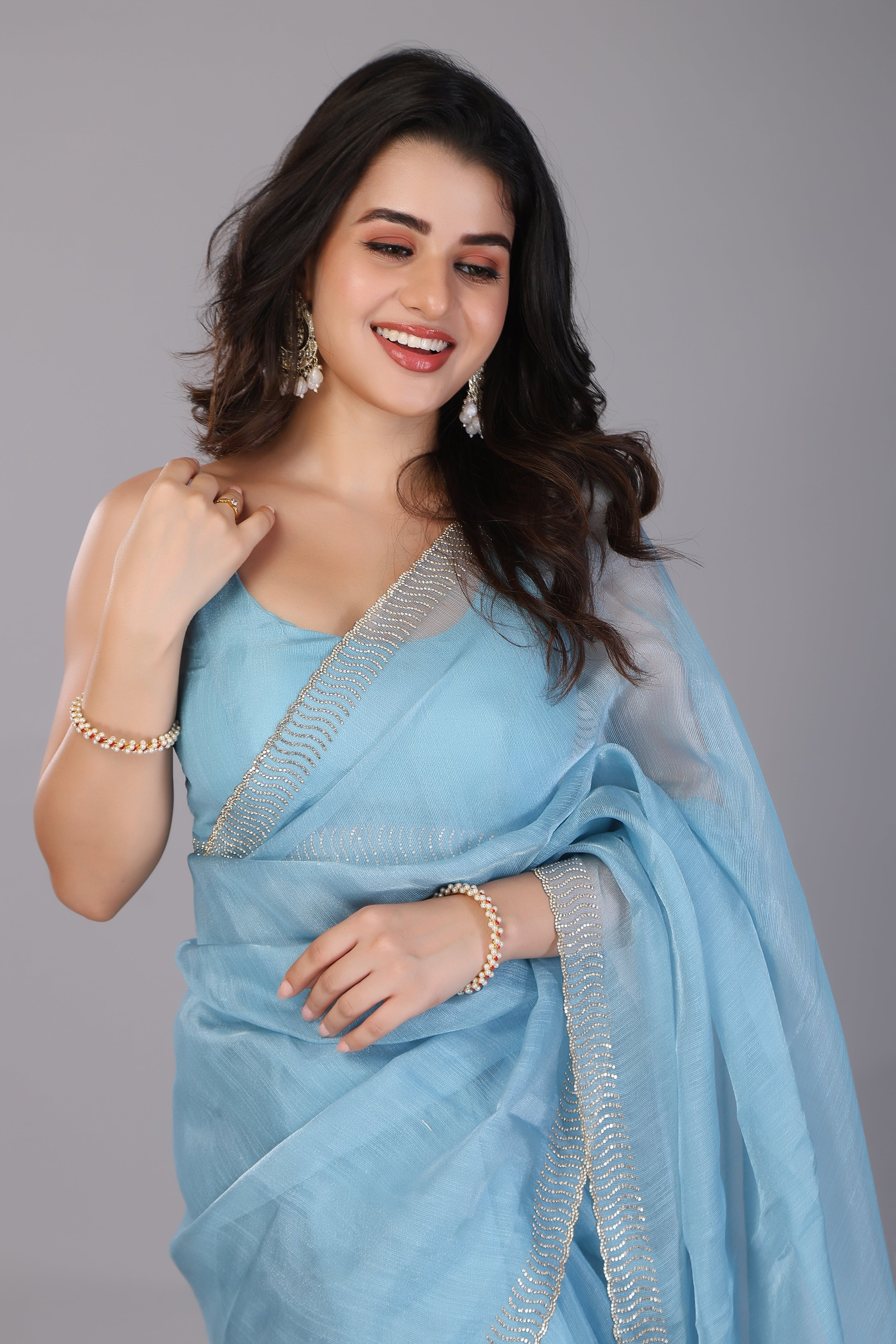 Sky blue stone work soft net saree