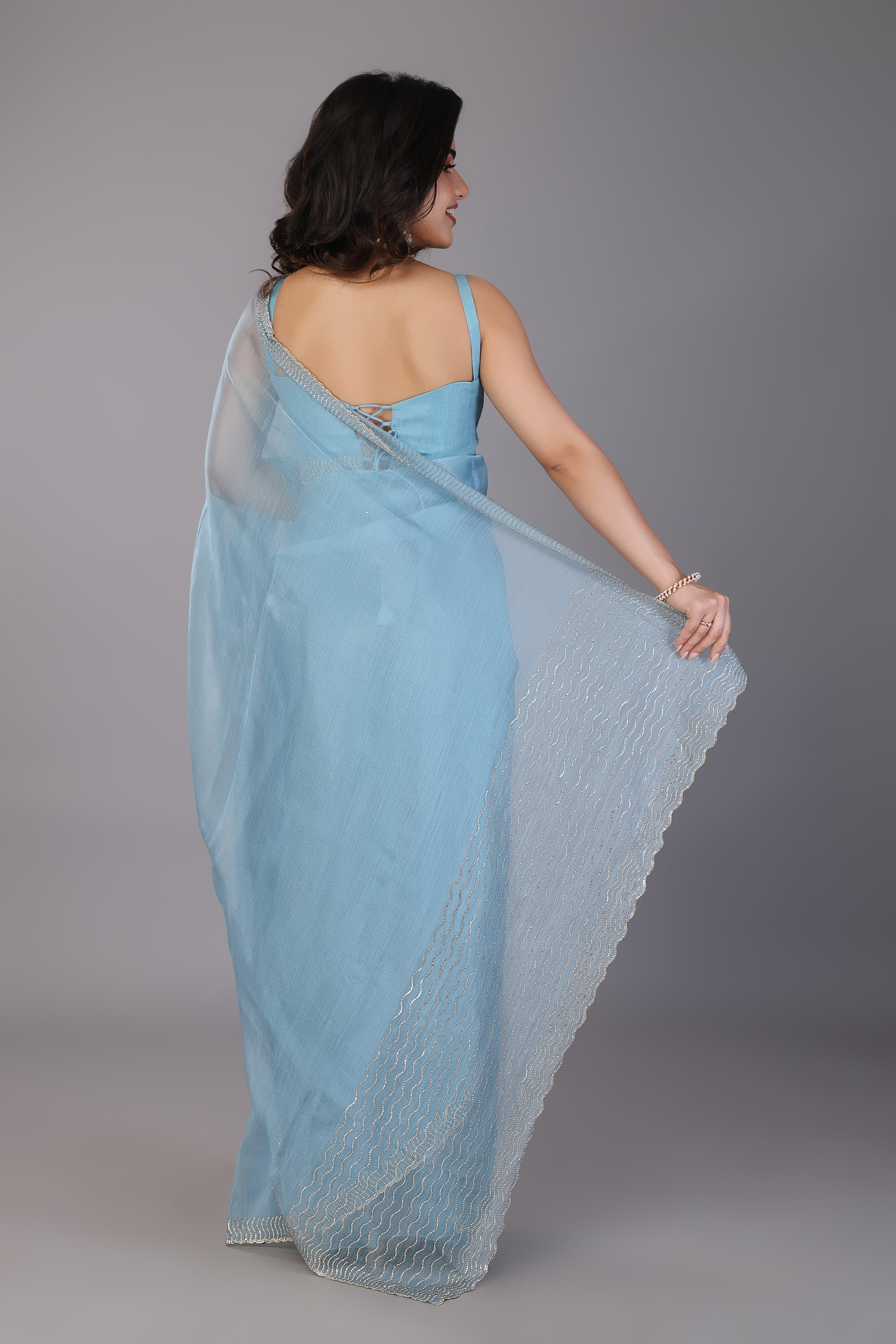 Sky blue stone work soft net saree