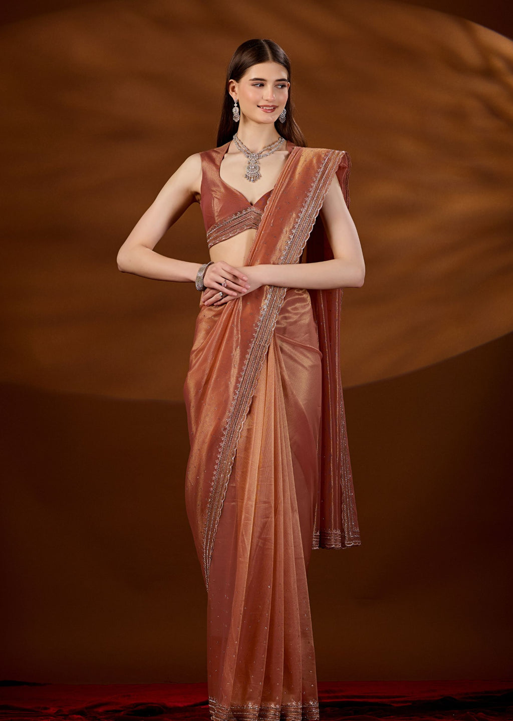 Peach Orange Tissue Saree Draped Pose - Festive Wear Saree