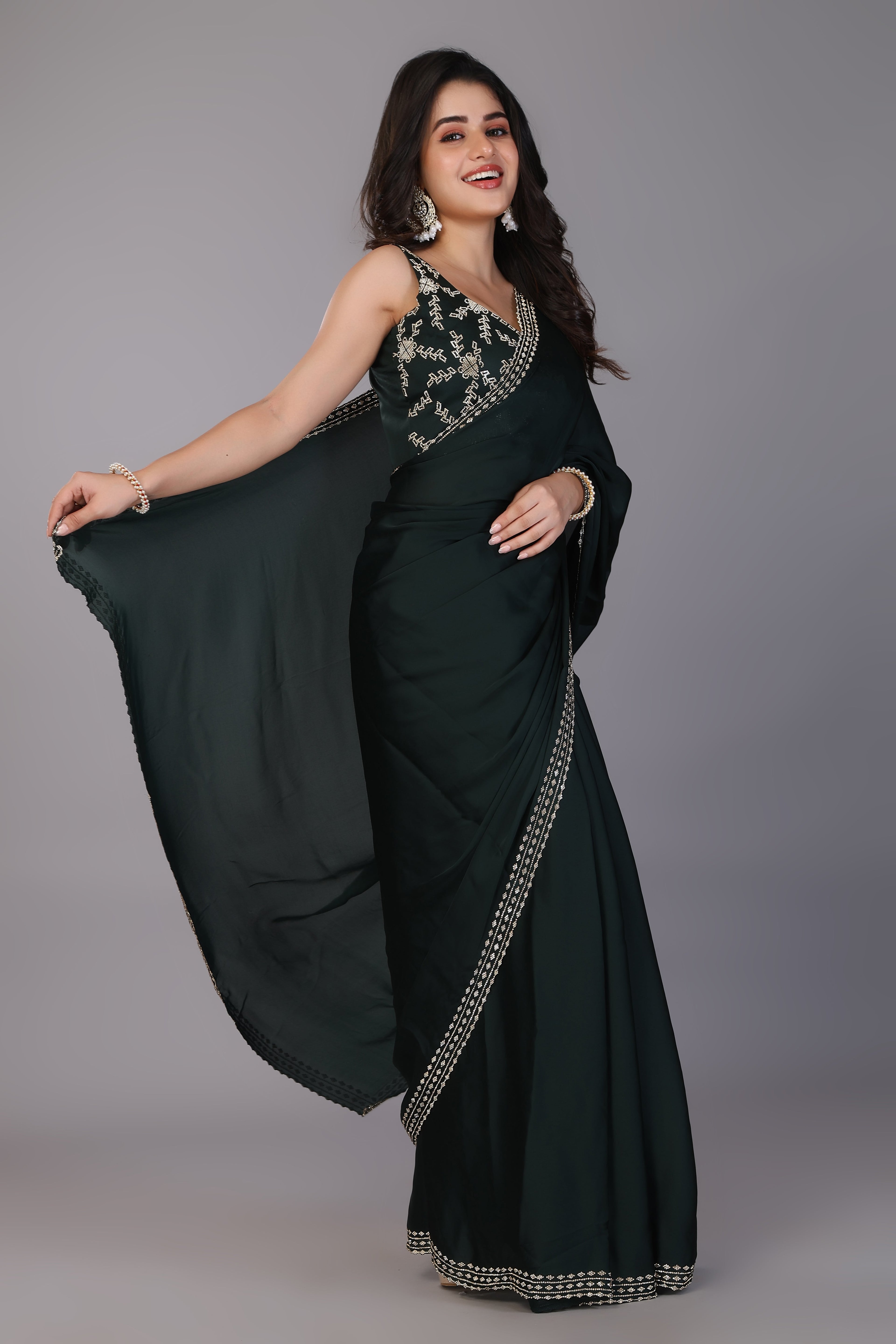 Dark green stone work pure satin saree