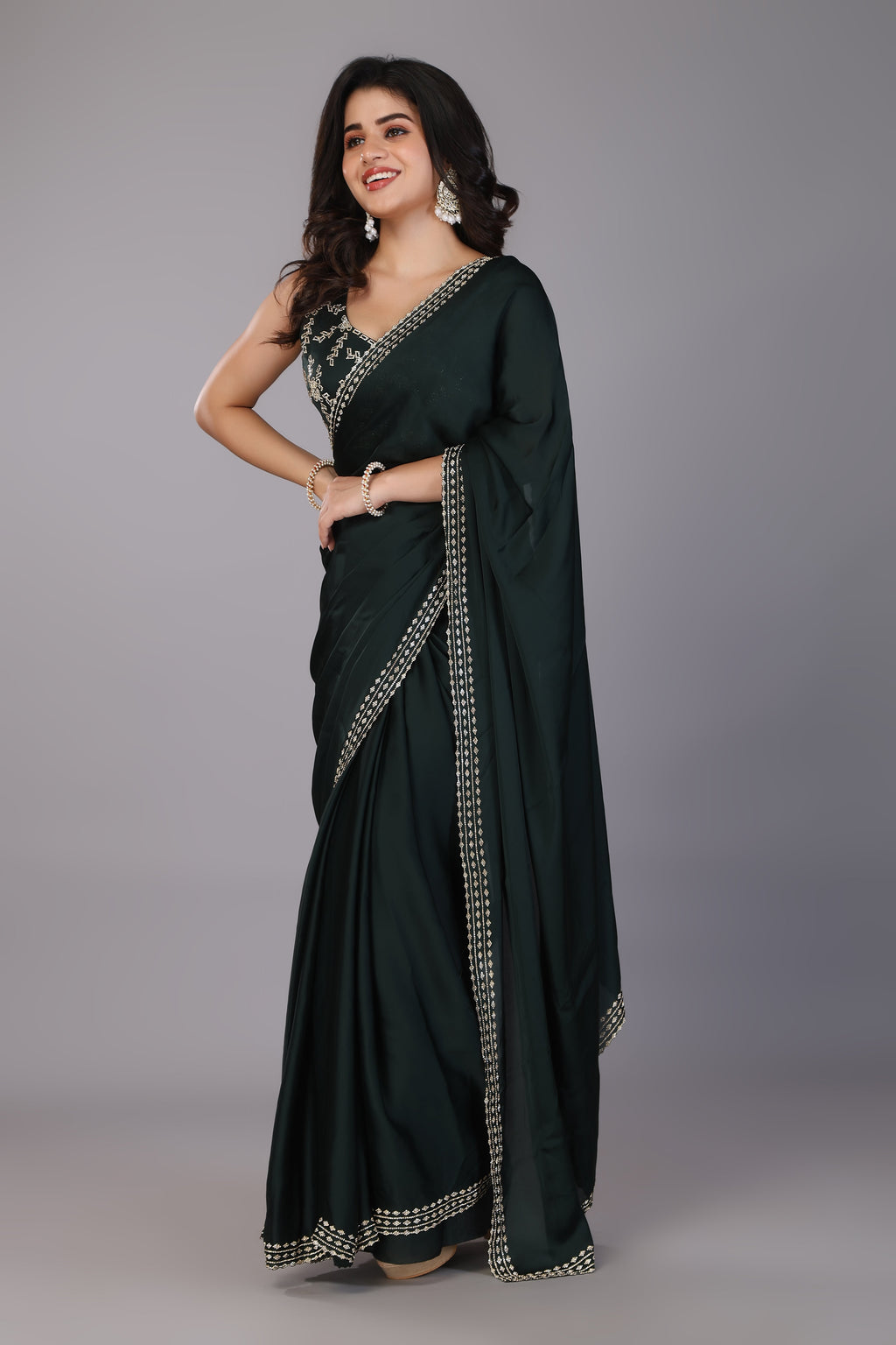 Dark green stone work pure satin saree
