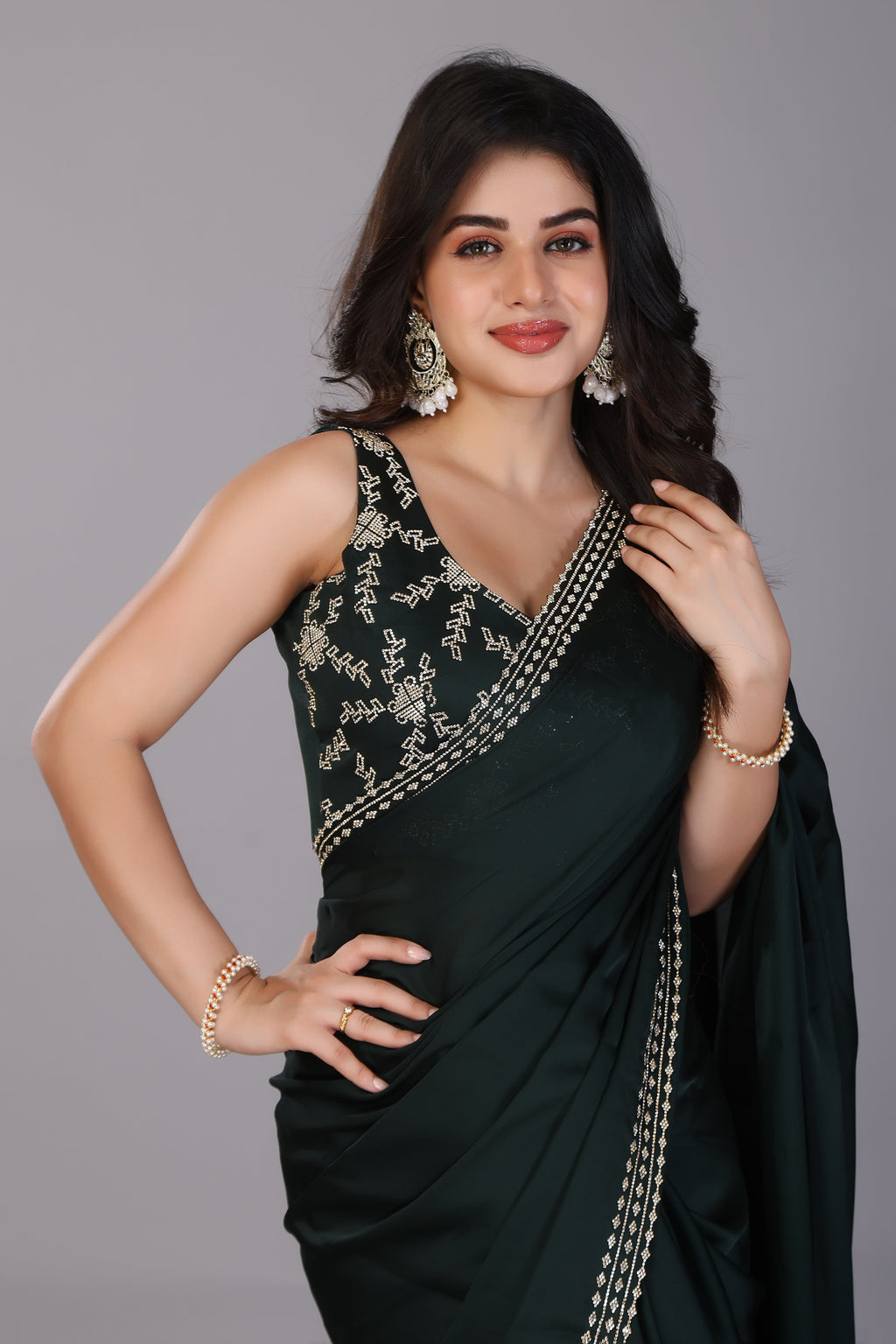 Dark green stone work pure satin saree
