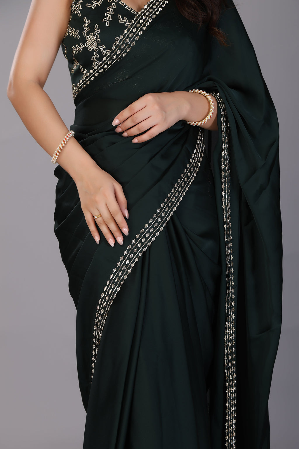 Dark green stone work pure satin saree
