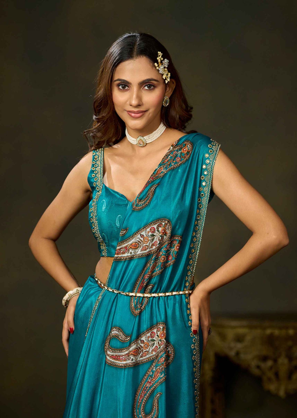 Front view of firozi satin silk saree with detailed paisley motifs and embellished border by Ethnic9.
