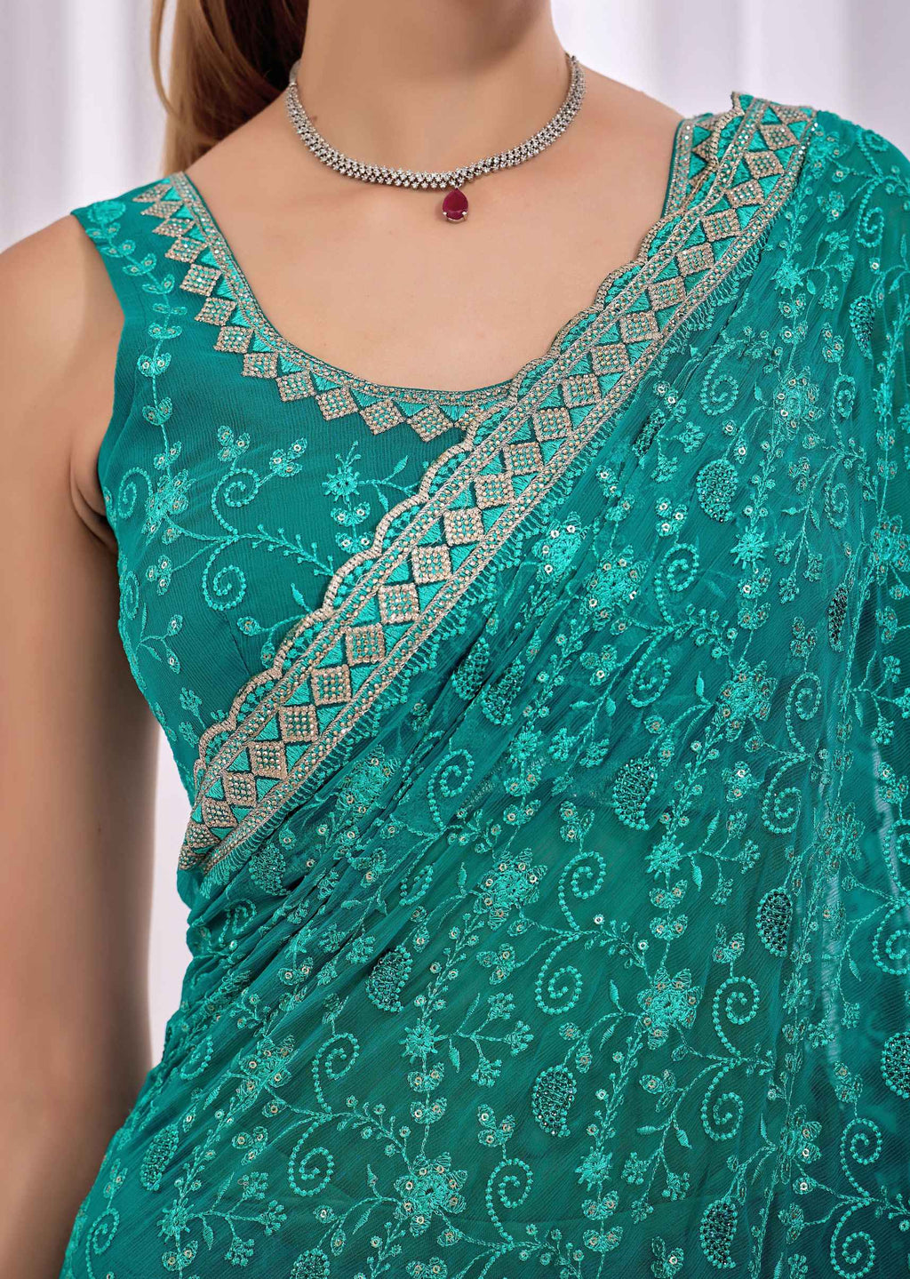 Firozi Chiffon Saree With Floral Embroidery And Stone Border