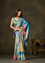 Elegant blue color block printed satin silk saree with multicolor pallu styled for festive occasions.