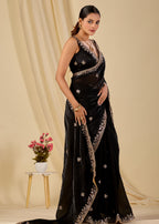 Woman wearing black embroidered organza saree