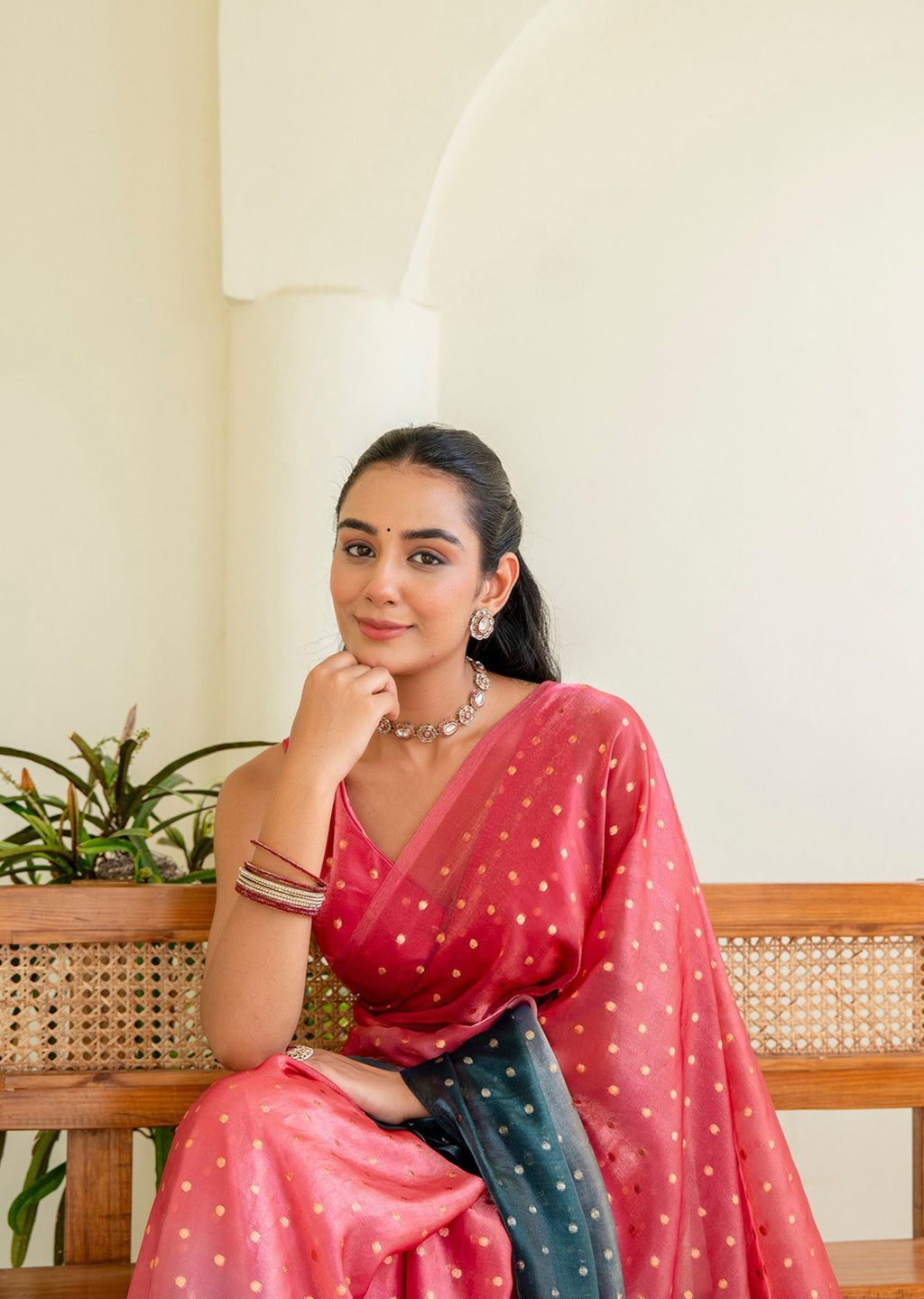 Coral Pink Organza Silk Saree Seated Pose - Sequin Work Detail
