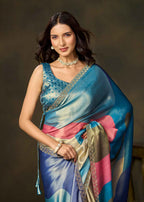 Woman in blue color block printed satin silk saree with contrasting pink and beige patterns by Ethnic9.