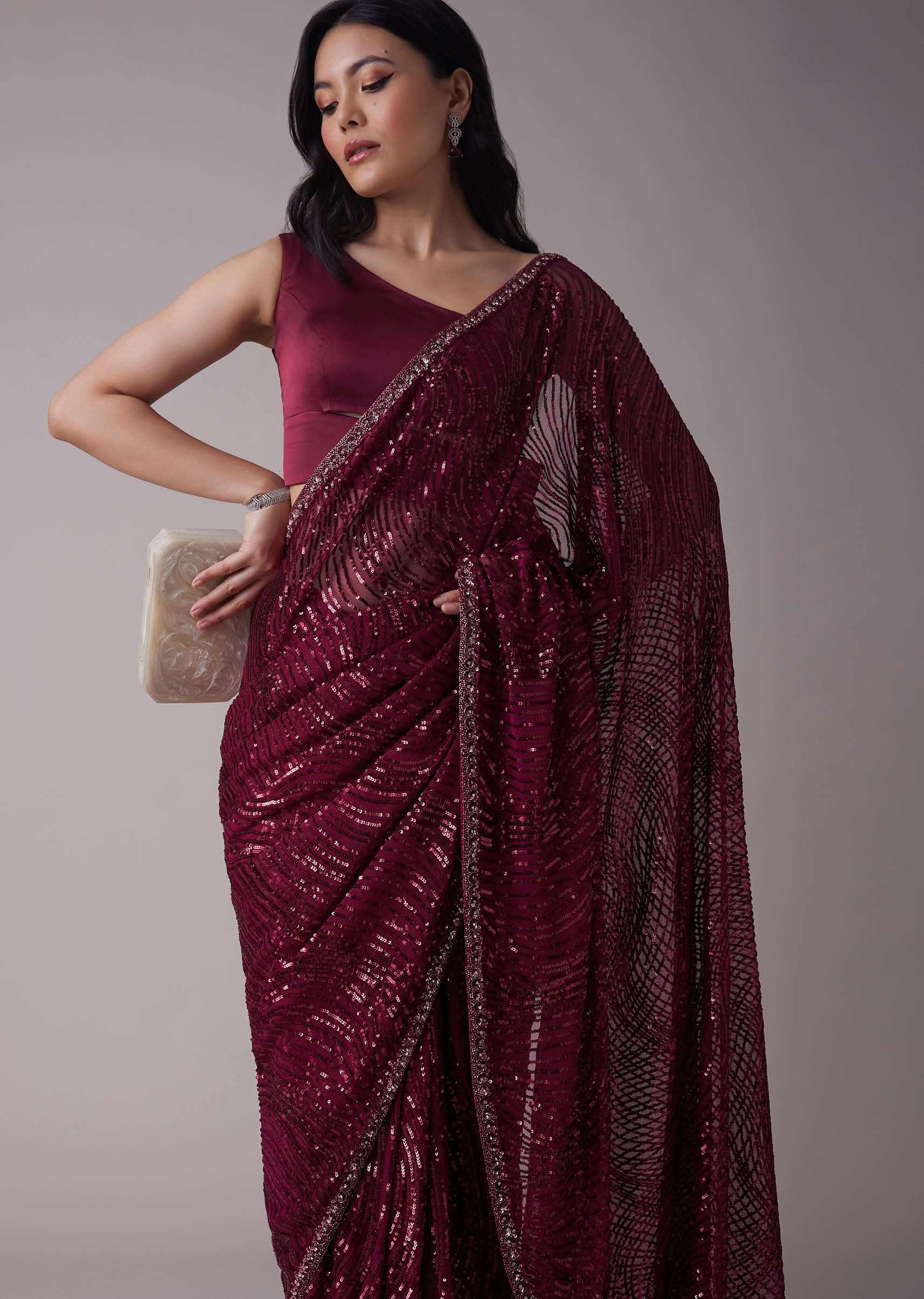 Wine Sequins Saree With An Embellished Border